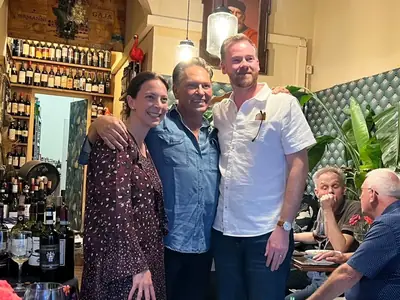 David and Laureen choosing wine with Leonardo in the shop in Florence